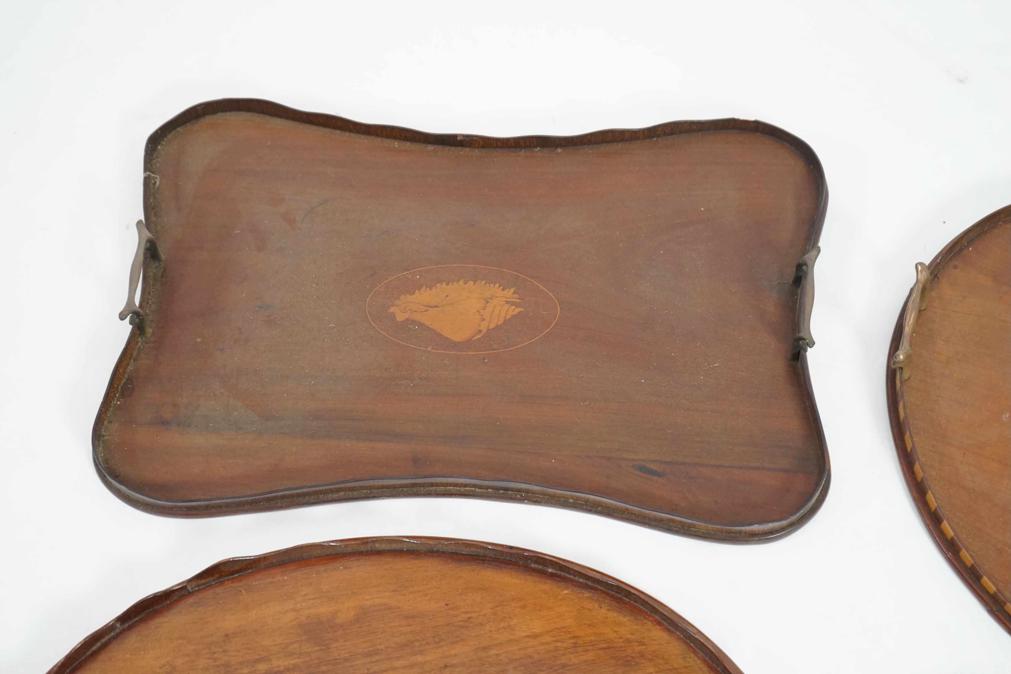 Four Edwardian inlaid mahogany gallery trays